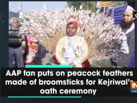 AAP fan puts on peacock feathers made of broomsticks for Kejriwal's oath ceremony