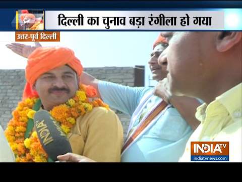 Manoj Tiwari holds a roadshow as part of his election campaign in Delhi