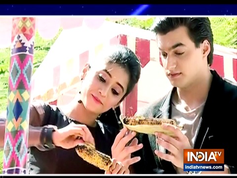 Who is trying to draw a wedge between Naira and Kartik?