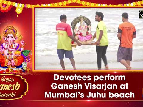 Devotees perform Ganesh Visarjan at Mumbai's Juhu beach