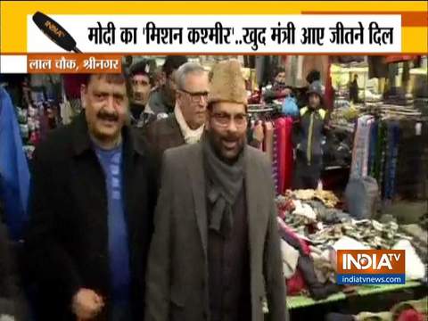 Mukhtar Abbas Naqvi interacts with locals at Lal Chowk in Srinagar