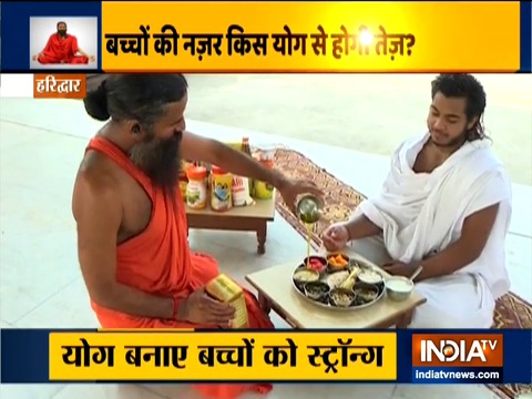 Swami Ramdev suggests doing yoga for good eyesight and height