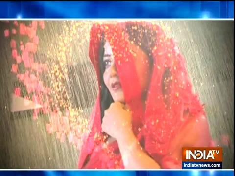 Daayan Mohana dances in the rain in a red saree