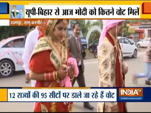 LS Election 2019: A newly married couple arrive at a polling station in Udhampur to cast their votes