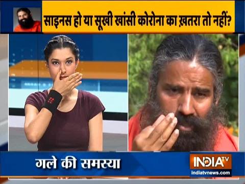 Swami Ramdev shows the correct way to do yogasanas to treat ENT disorders