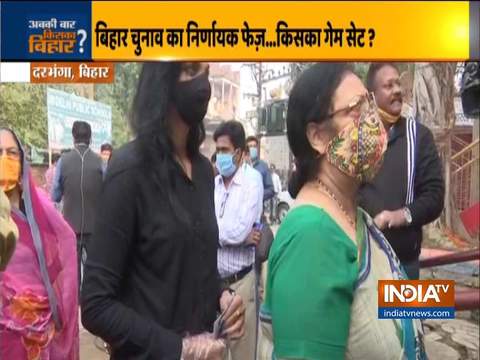 Pushpam Priya Choudhary stands in queues outside a polling station in Darbhanga to cast her vote