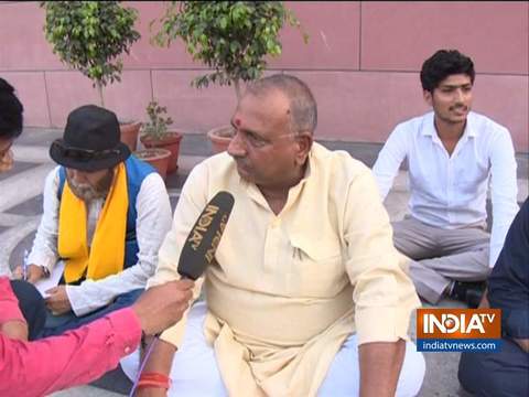 BJP leader Bhairon Prasad Mishra sits on dharna outside Party HQ after denied ticket to contest polls