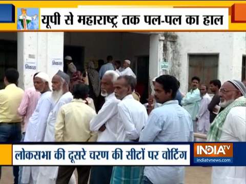 People queue up outside polling stations in Kishanganj and Fatehpur to cast their vote