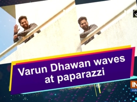 Varun Dhawan waves at paparazzi