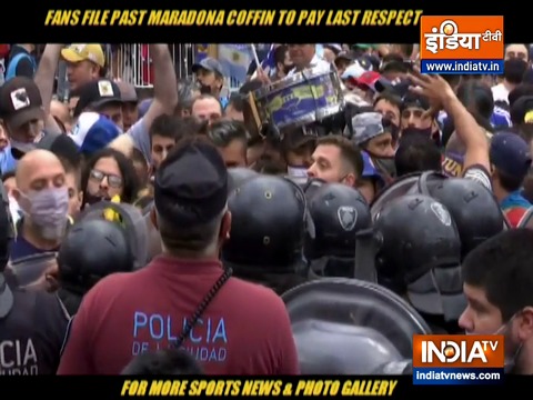 Fans scramble to catch a glimpse of Maradona's coffin