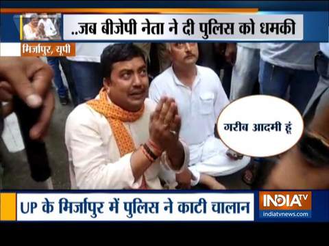 BJP leader Anil Singh sits on road in Mirzapur